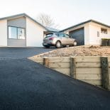 Example of an asphalt driveway and retaining wall solution
