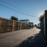 Example of asphalt driveway and fence