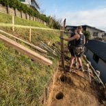 Preparing to install posts for retaining wall