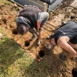 Prparing holes for retaining wall posts